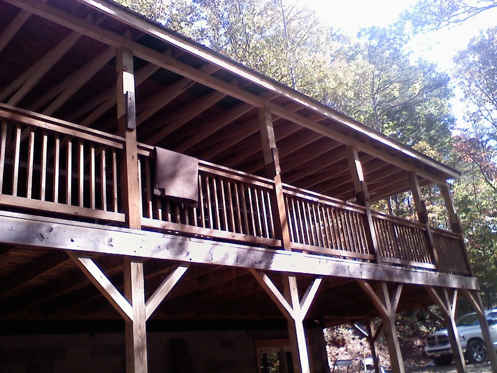 Timber framing under a new elevated porch and deck — Roof Leak Repair in Champlain by Roofing Brothers